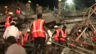 Rescue workers in the rubble