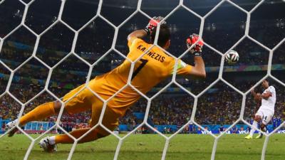 Michael Umana scores Costa Rica's final penalty in their shoot-out win over Greece