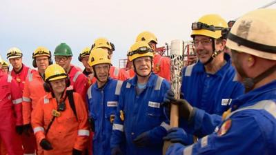 Queen's baton on an oil platform