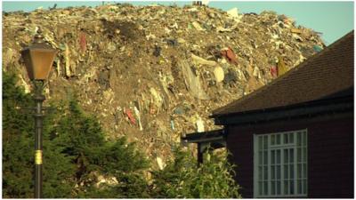 Rubbish mound behind property