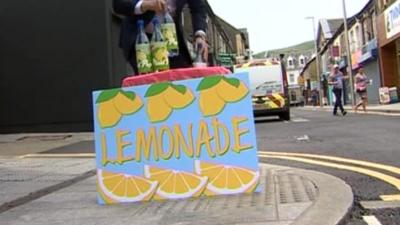 Mock-up of a lemonade stall on a street in Porth
