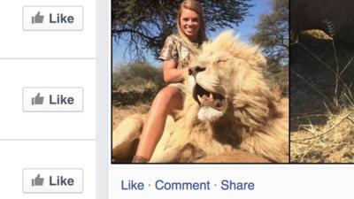 Kendall Jones holding a dead lion