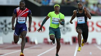 Justin Gatlin of USA (L), Michael Rodgers of USA (C) and Tyson Gay of USA compete in the Men's 100m race