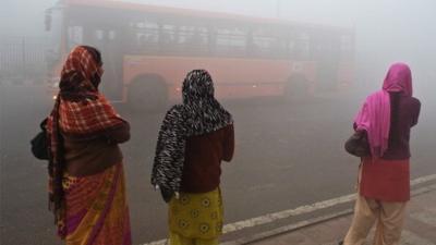 Indian women waiting for bus