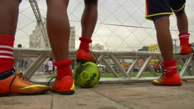 Boys playing football in the Street World Cup