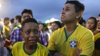 Brazil football fans cry as they watch their team