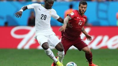 Kwadwo Asamoah of Ghana and Vieirinha of Portugal compete for the ball