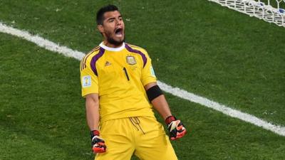 Argentina's goalkeeper Sergio Romero reacts after saving a penalty