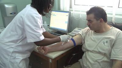 Man having blood test in Ghanaian clinic