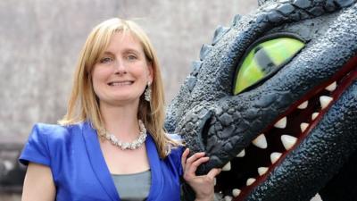 Author Cressida Cowell and Toothless the dragon