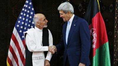 John Kerry shakes hands with Afghanistan presidential candidate Ashraf Ghani