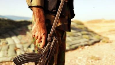 Kurdish soldiers with the Peshmerga keep guard near the frontline with Sunni militants on the outskirts of Kirkuk, an oil-rich Iraqi city on June 25, 2014 in Kirkuk, Iraq