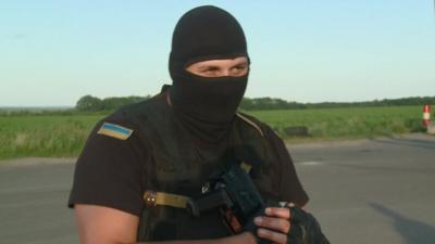 Ukrainian soldier holding a gun