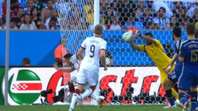 A shot from Germany's Andre Schurrle forces a sharp save from Argentina goalkeeper Sergio Romero in the 2014 World Cup final