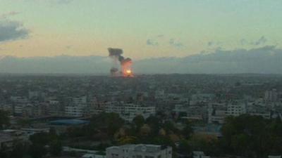 Gaza skyline with explosions