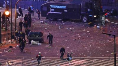 Argentina"s fans clash with riot police after Argentina lost to Germany in their 2014 World Cup final soccer match in Brazil, at a public square viewing area in Buenos Aires July 13, 2014