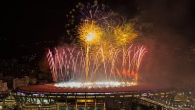 Fireworks are launched over the Maracana Stadium in Rio de Janeiro, Brazil