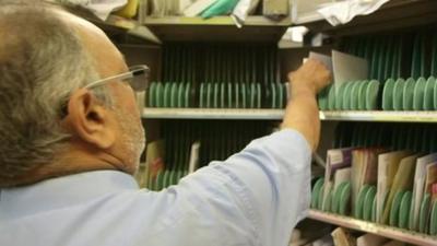 Postman sorting mail