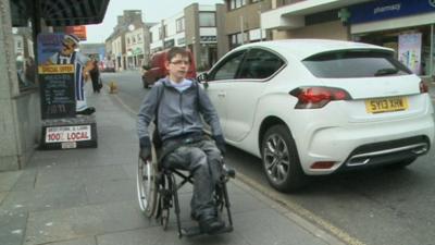 Kieran in wheelchair