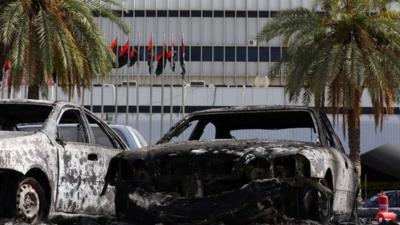 Burnt vehicles in the compound of Tripoli international airport