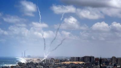 Smoke from rockets fired from near Gaza City