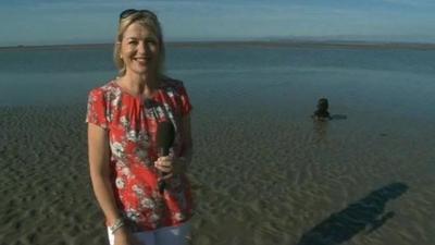 Carol Kirkwood with dog in background