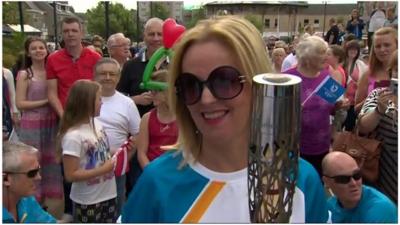 Clare Grogan carries the Queen's baton in Johnstone