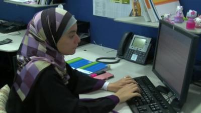 Islamic bank employee typing