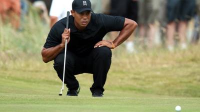 The Open: Tiger Woods holes putt to avoid missing cut