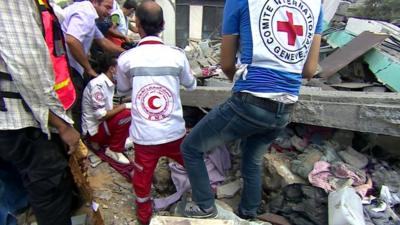 Rescuers pull woman from rubble