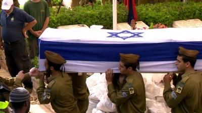 Israeli soldier's coffin being carried