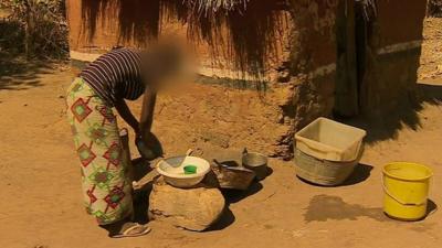 teenager washes pots