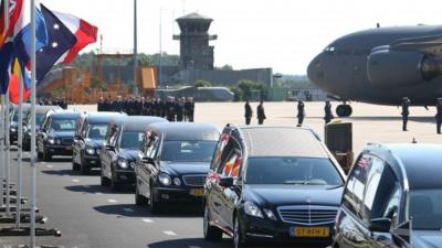 Hearses carry coffins containing unidentified bodies from the crash of Malaysia Airlines flight MH17