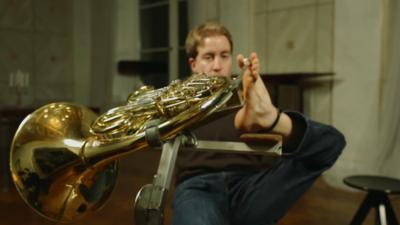 Felix playing French horn