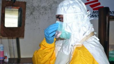 Doctor in protective clothing in Guinea
