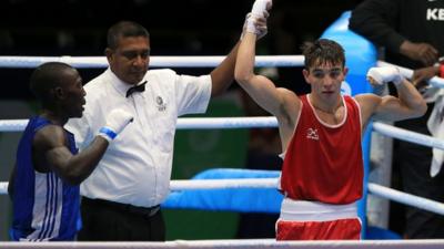 Northern Ireland's Michael Conlan celebrates winning his match against Uganda's Bashir Nasir