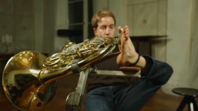 Felix playing French horn