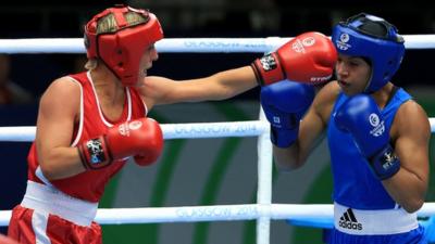 Northern Ireland's Alanna Audley-Murphy in action against Valerian Spicer of Dominica