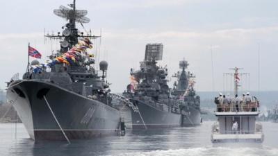 Russian warships are seen during a naval parade rehearsal in the Crimean port of Sevastopol, July 25, 2014