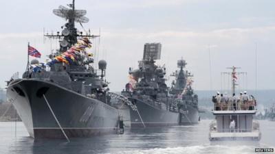 Russian warships are seen during a naval parade rehearsal in the Crimean port of Sevastopol, July 25, 2014