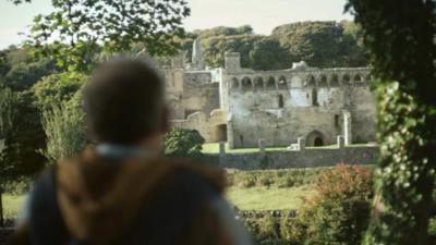 Tourist visits a Welsh castle