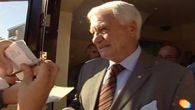 Sir Bobby Robson with autograph seekers