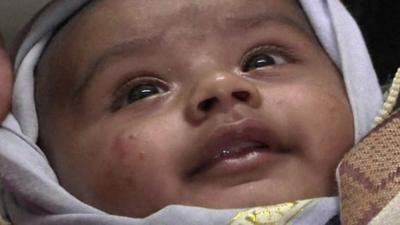 three-month-old baby, who were rescued eight hours after the landslide