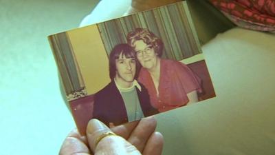 Gail Morris holds a photo of her aunt Edith Evans