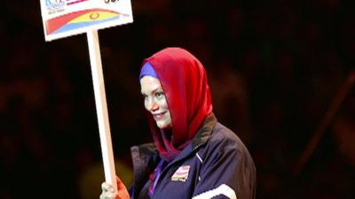 Christina Kelley leads the US team in the opening ceremony of 2014 Wrestling World Cup in Tehran, Iran.