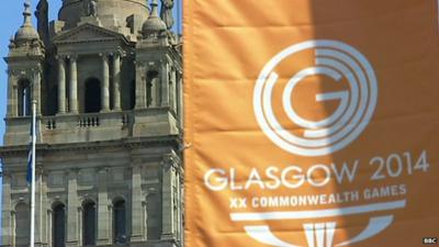 Glasgow building with orange banner showing logo of Commonwealth Games 2014