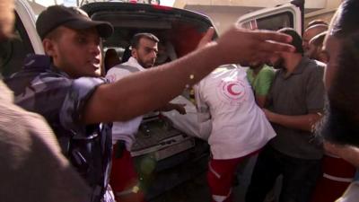 An ambulance brings wounded Palestinians to a Rafah hospital, 2 August 2014