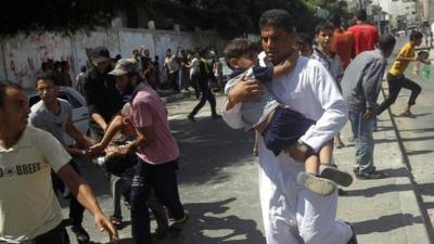 Children are carried from the site of the Rafah attack, 3 Aug