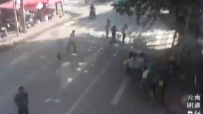 CCTV shows people running for cover as the China quake strikes