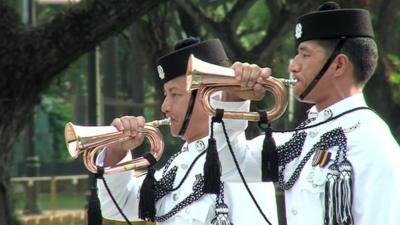 Two Singapore Army trumpeters play at tribute to start of WW1